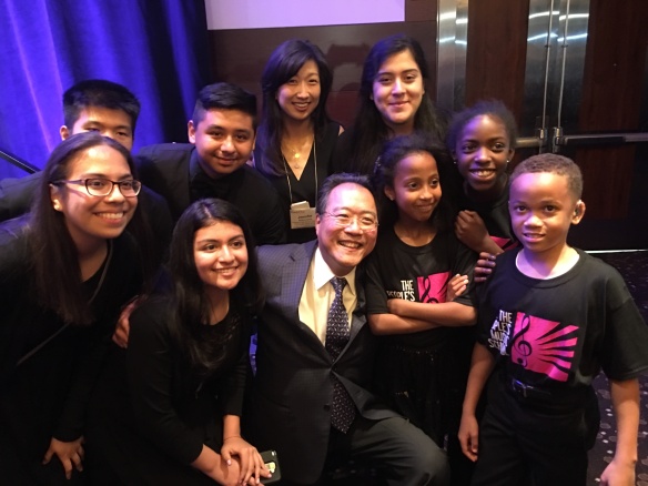 Yo-Yo Ma with students from The People's Music School, with whom he performed at Forefront and TPMS Exec Director Jennifer Matsuzawa.